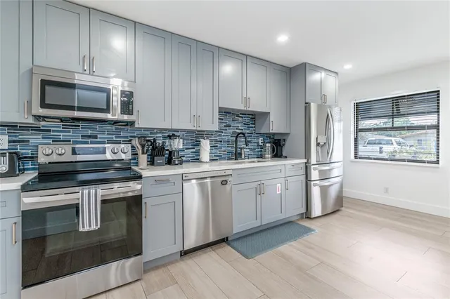 a living room with furniture a window and a table