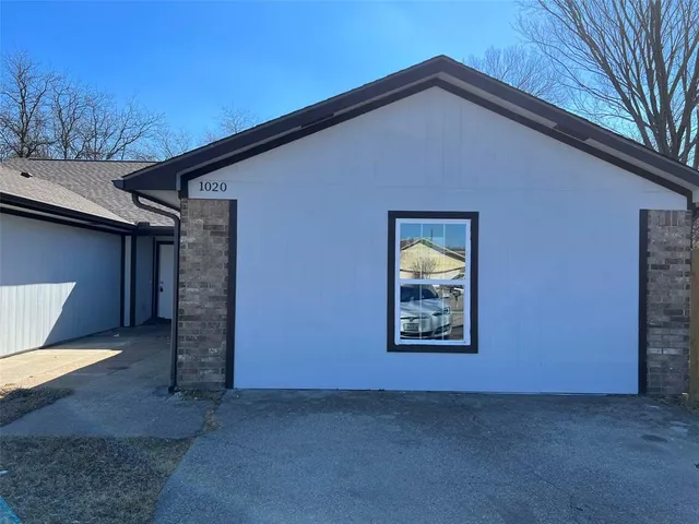 a view of an empty room with a garage