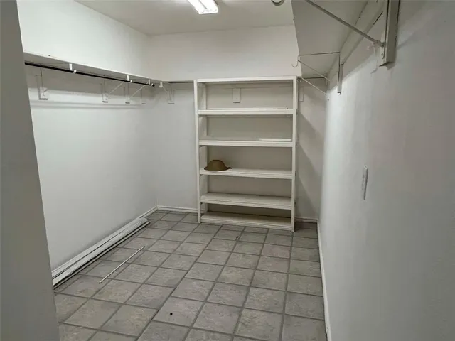 a view of an empty walk in closet