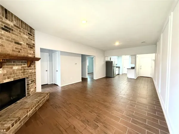 a view of a livingroom with furniture and a fireplace