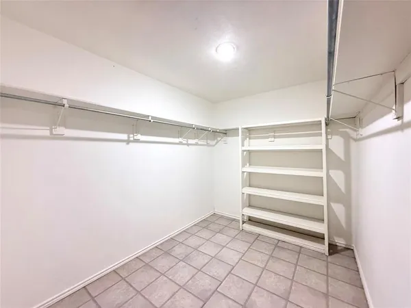 a view of an empty walk in closet