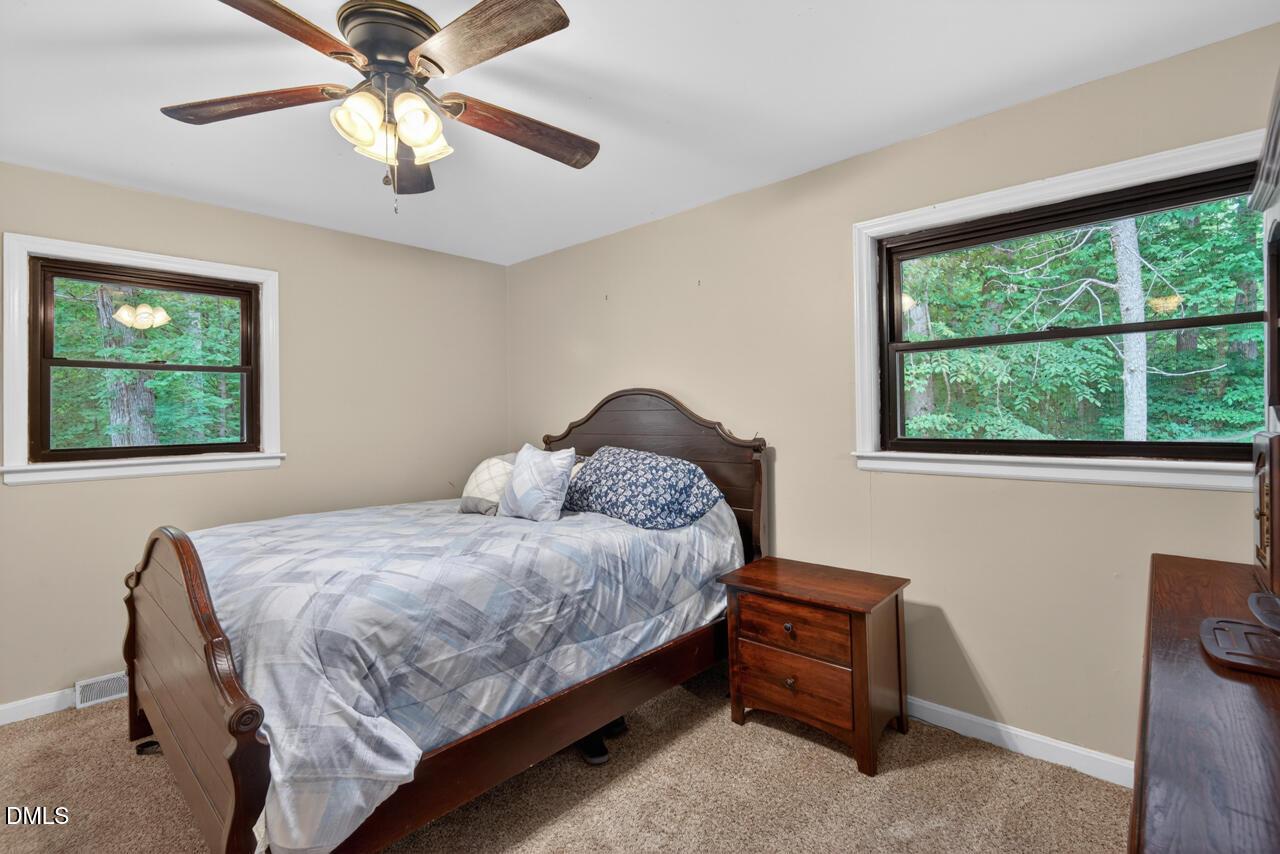 1420 Goodwin Road Durham, NC 27712 - Photo 24 of 54 a bedroom with a bed and a window