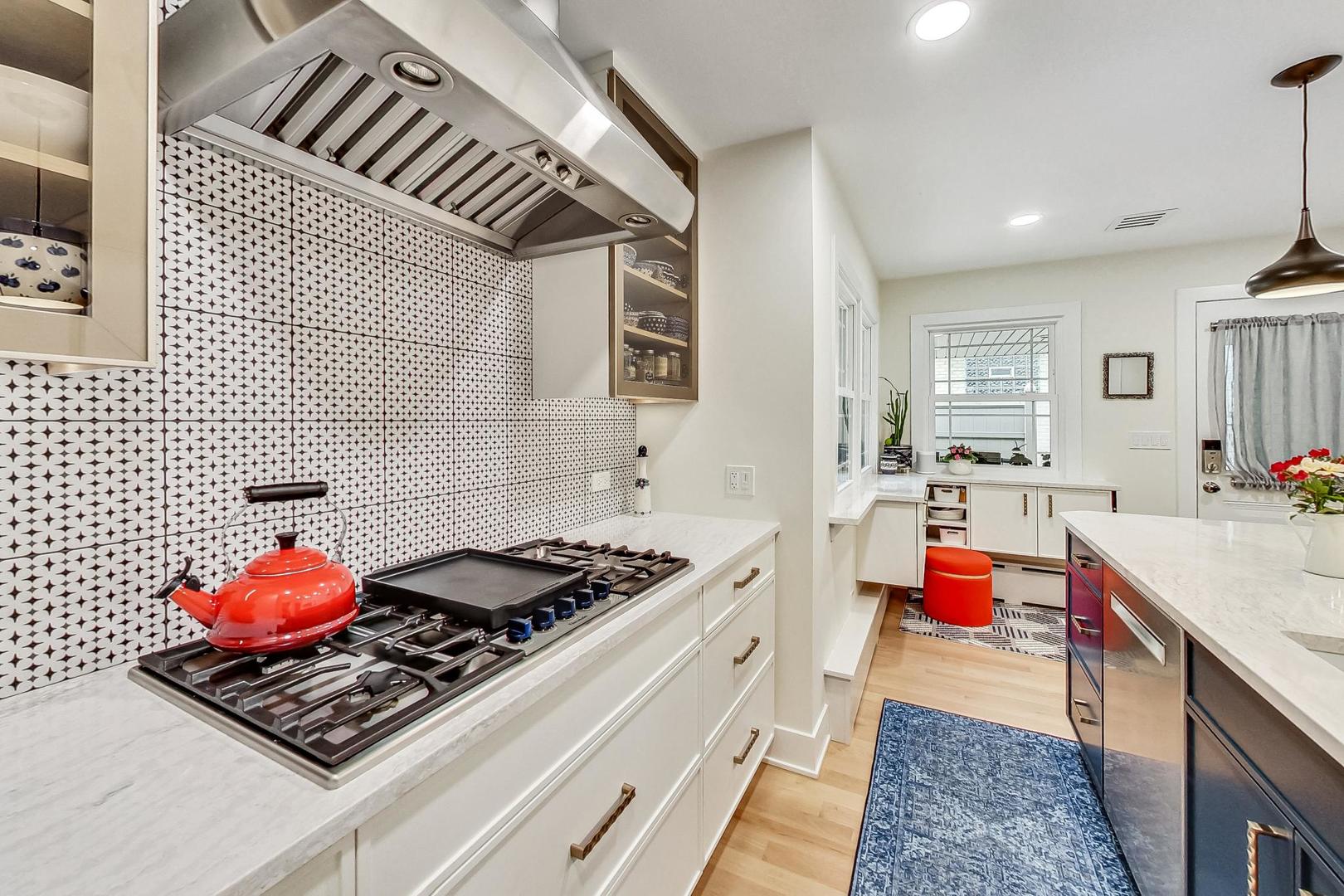 1314 Tyrell Avenue Park Ridge, IL 60068 - Photo 11 of 25 a kitchen with stainless steel appliances granite countertop a stove and cabinets