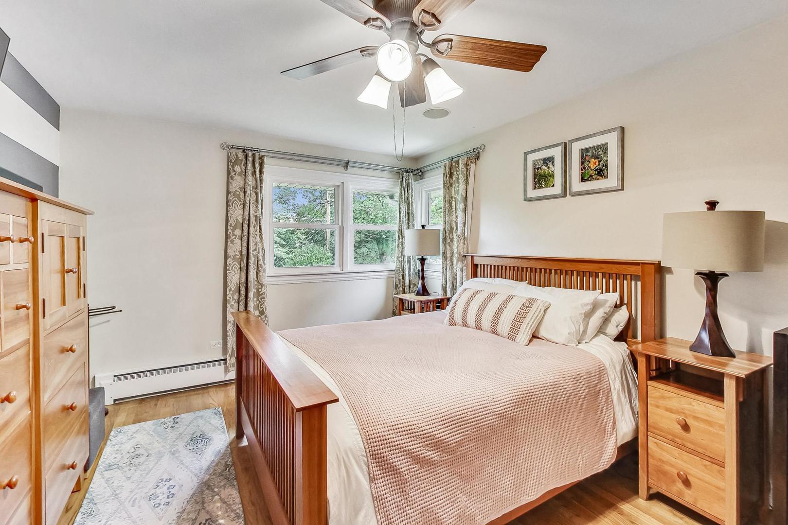 1314 Tyrell Avenue Park Ridge, IL 60068 - Photo 12 of 25 a bedroom with a bed and a chandelier