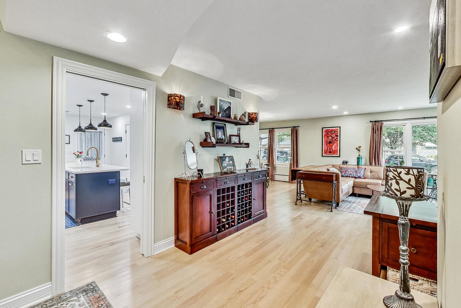 1314 Tyrell Avenue Park Ridge, IL 60068 - Photo 3 of 25 a living room with furniture flat screen tv and large window
