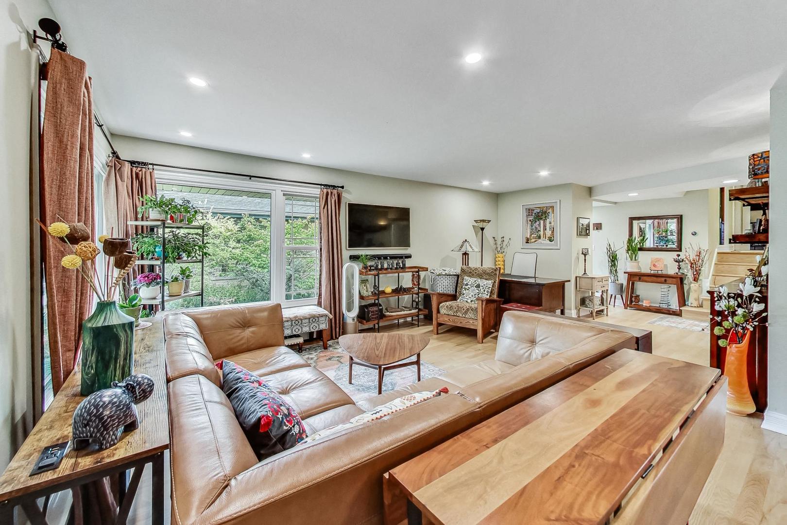 1314 Tyrell Avenue Park Ridge, IL 60068 - Photo 5 of 25 a living room with furniture large window and wooden floor