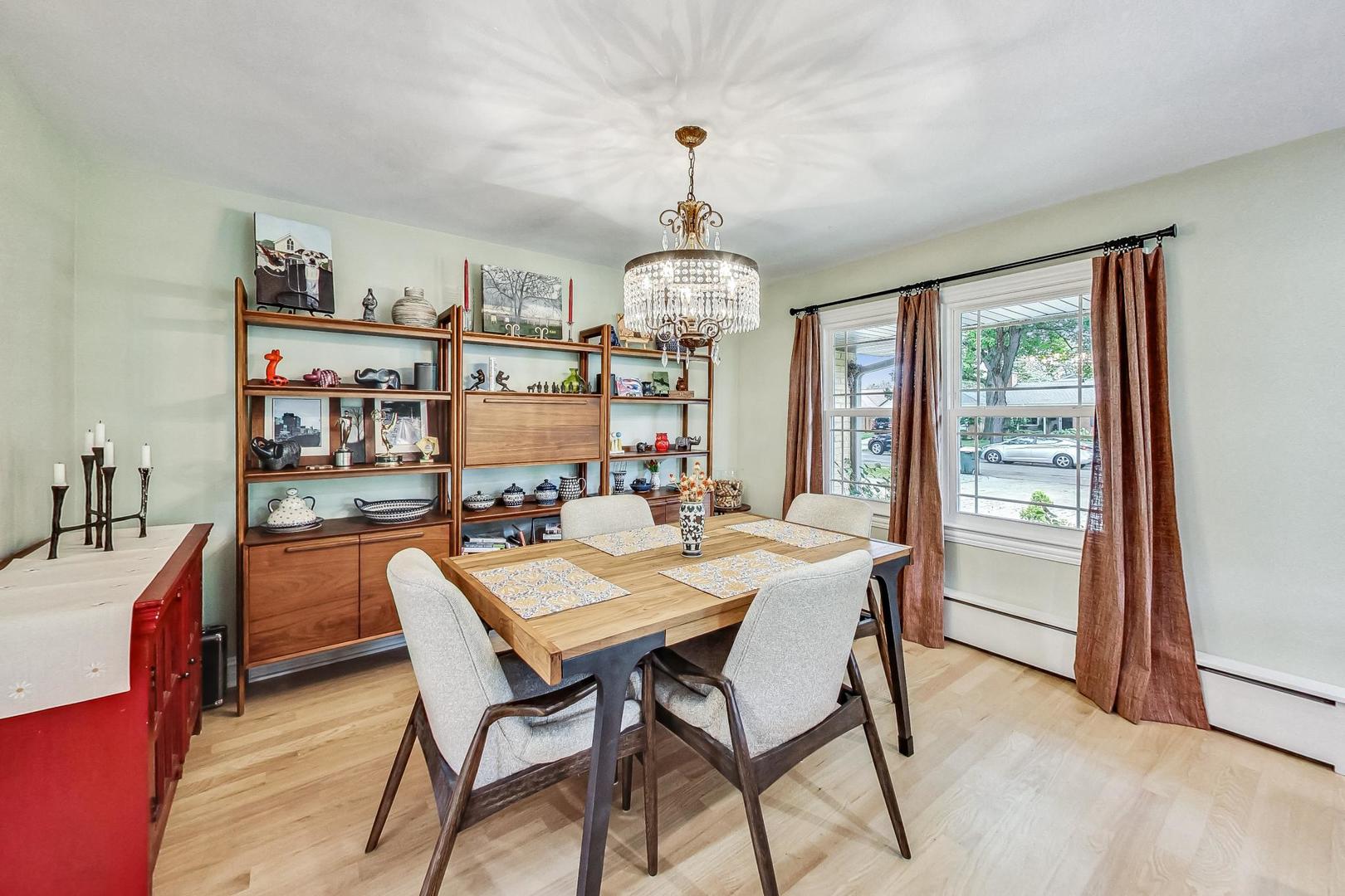 1314 Tyrell Avenue Park Ridge, IL 60068 - Photo 7 of 25 a dining room with furniture a chandelier and window