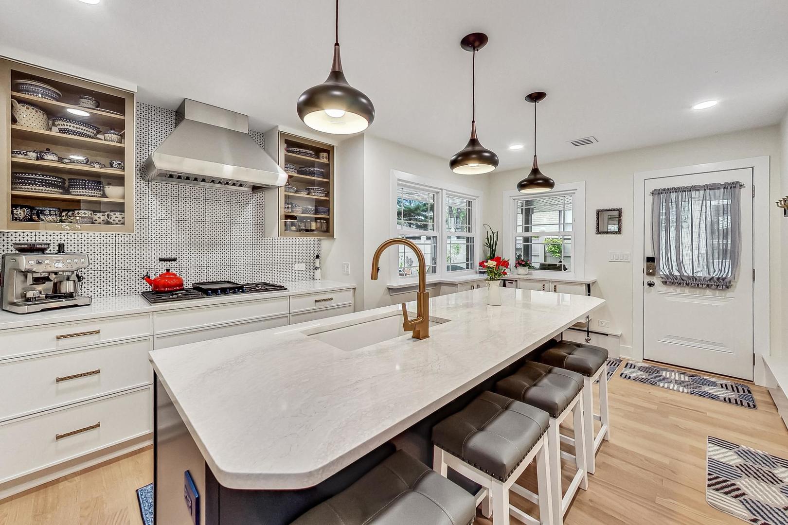 1314 Tyrell Avenue Park Ridge, IL 60068 - Photo 8 of 25 a kitchen with stainless steel appliances kitchen island a table and chairs in it