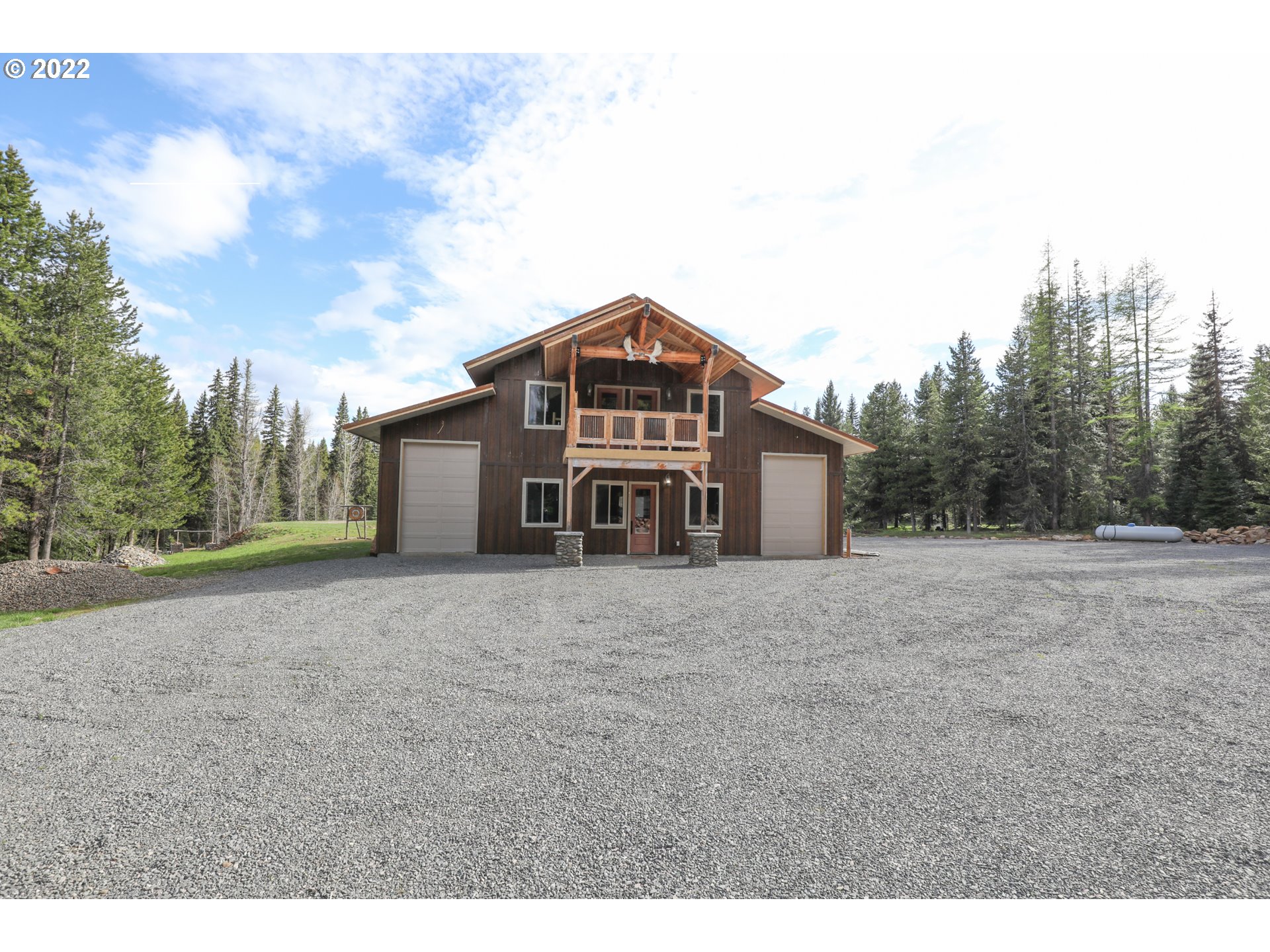 79250 Lookout Mountain Road Elgin, OR 97827 - Photo 11 of 28 a big house with a big yard and large trees