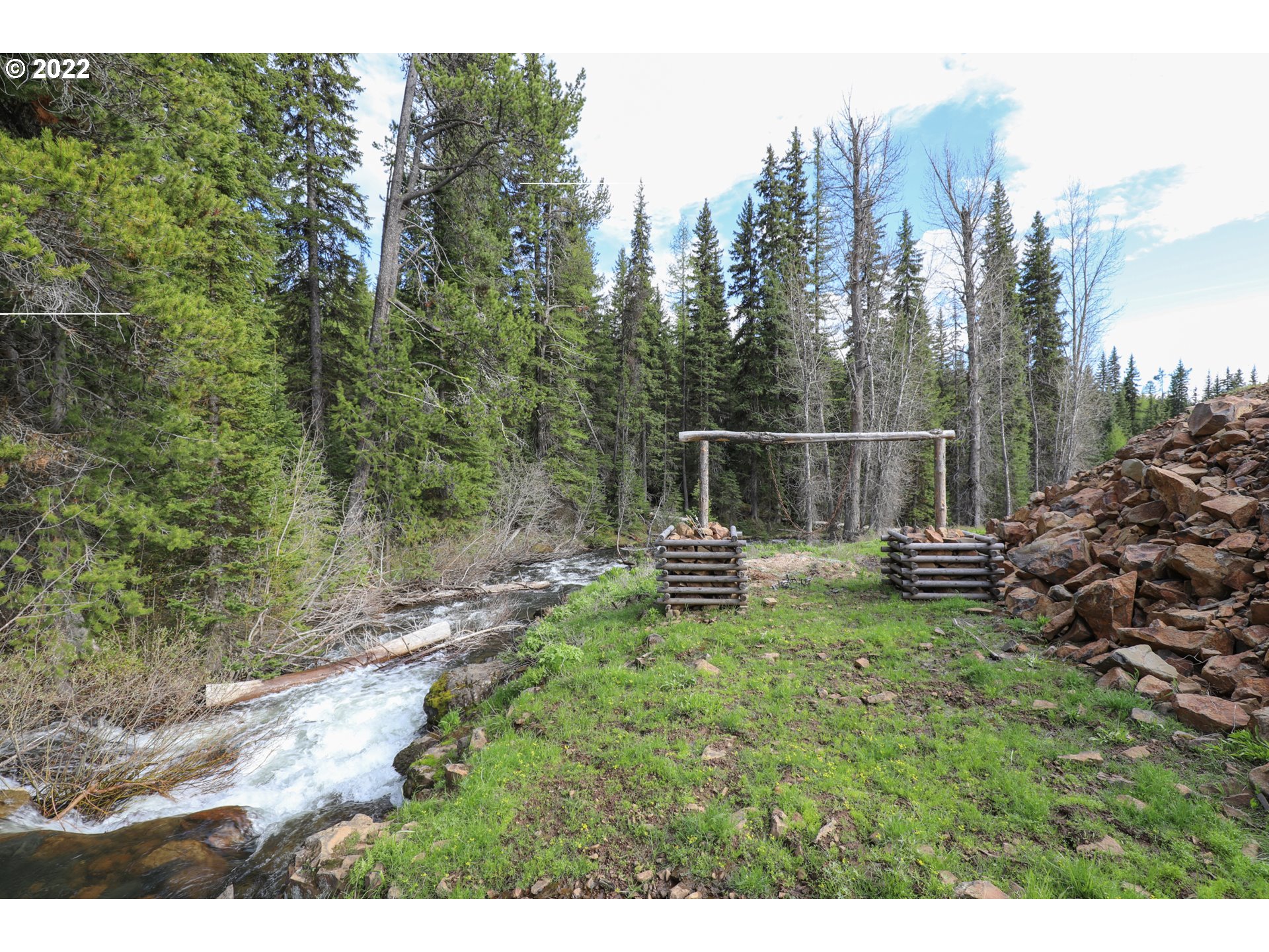 79250 Lookout Mountain Road Elgin, OR 97827 - Photo 16 of 28 a view of a bench in the middle of a forest