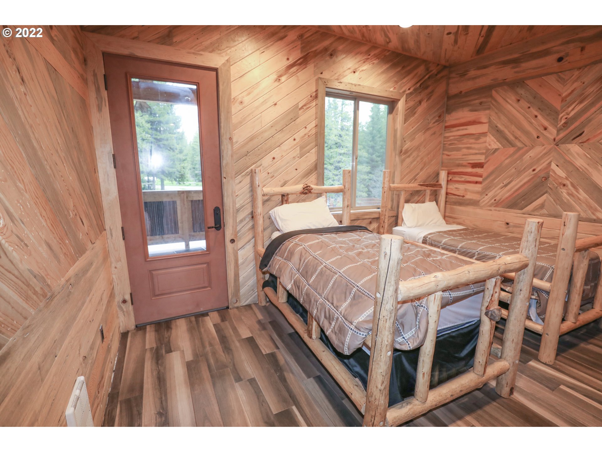 79250 Lookout Mountain Road Elgin, OR 97827 - Photo 18 of 28 a bedroom with a bed and a window