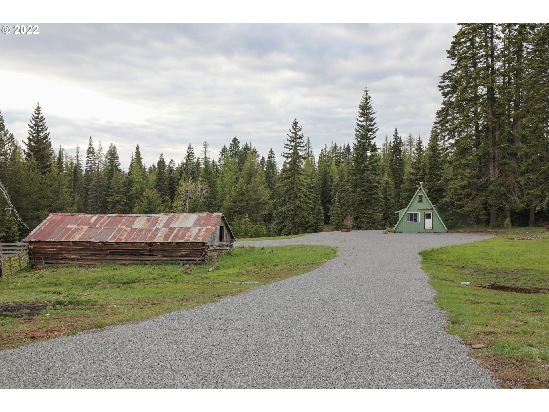 79250 Lookout Mountain Road Elgin, OR 97827 - Photo 28 of 28 a small garden covered with tall trees