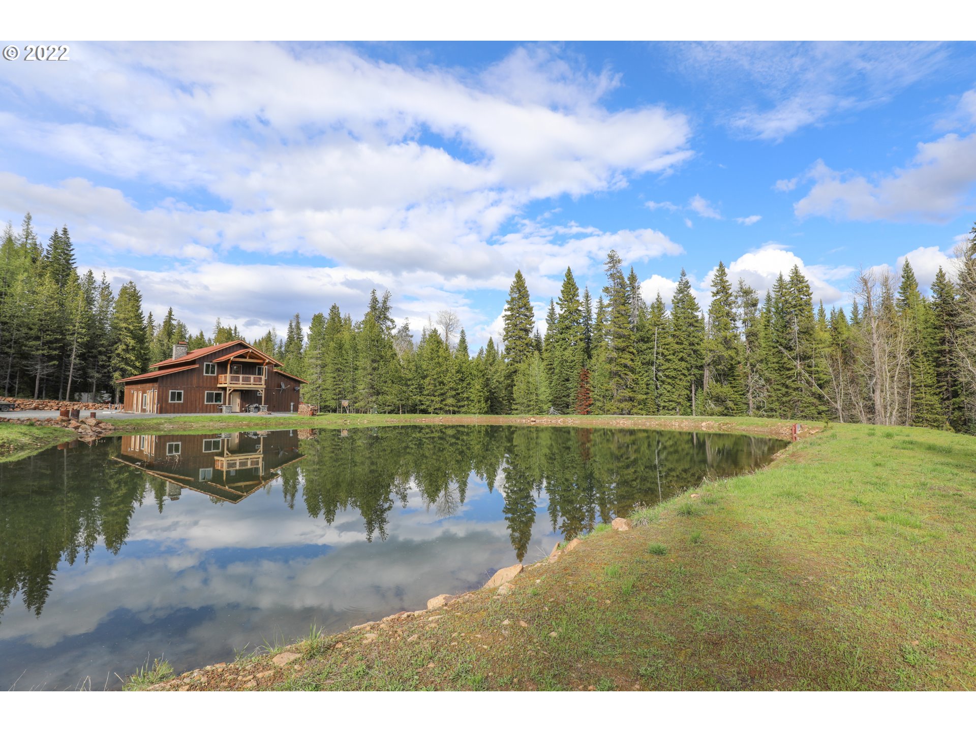 79250 Lookout Mountain Road Elgin, OR 97827 - Photo 4 of 28 a view of a lake with a yard from a lake