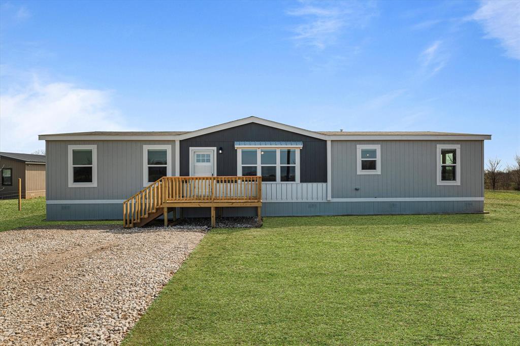 3888 Sandusky Road Whitesboro, TX 76273 - Photo 2 of 39 Rear view of house featuring a lawn, crawl space, and a deck
