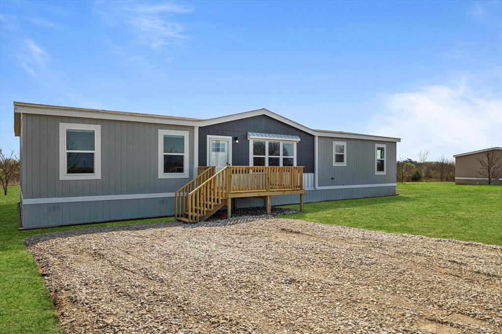 3888 Sandusky Road Whitesboro, TX 76273 - Photo 4 of 39 Back of house with a lawn and a wooden deck