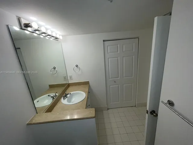 a bathroom with a toilet sink and vanity
