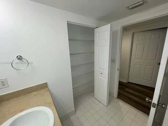 a bathroom with a sink and toilet