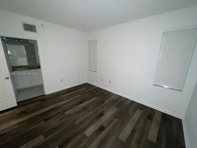 a bathroom with a shower sink vanity granite and toilet