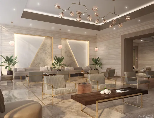 a living room with furniture and a chandelier