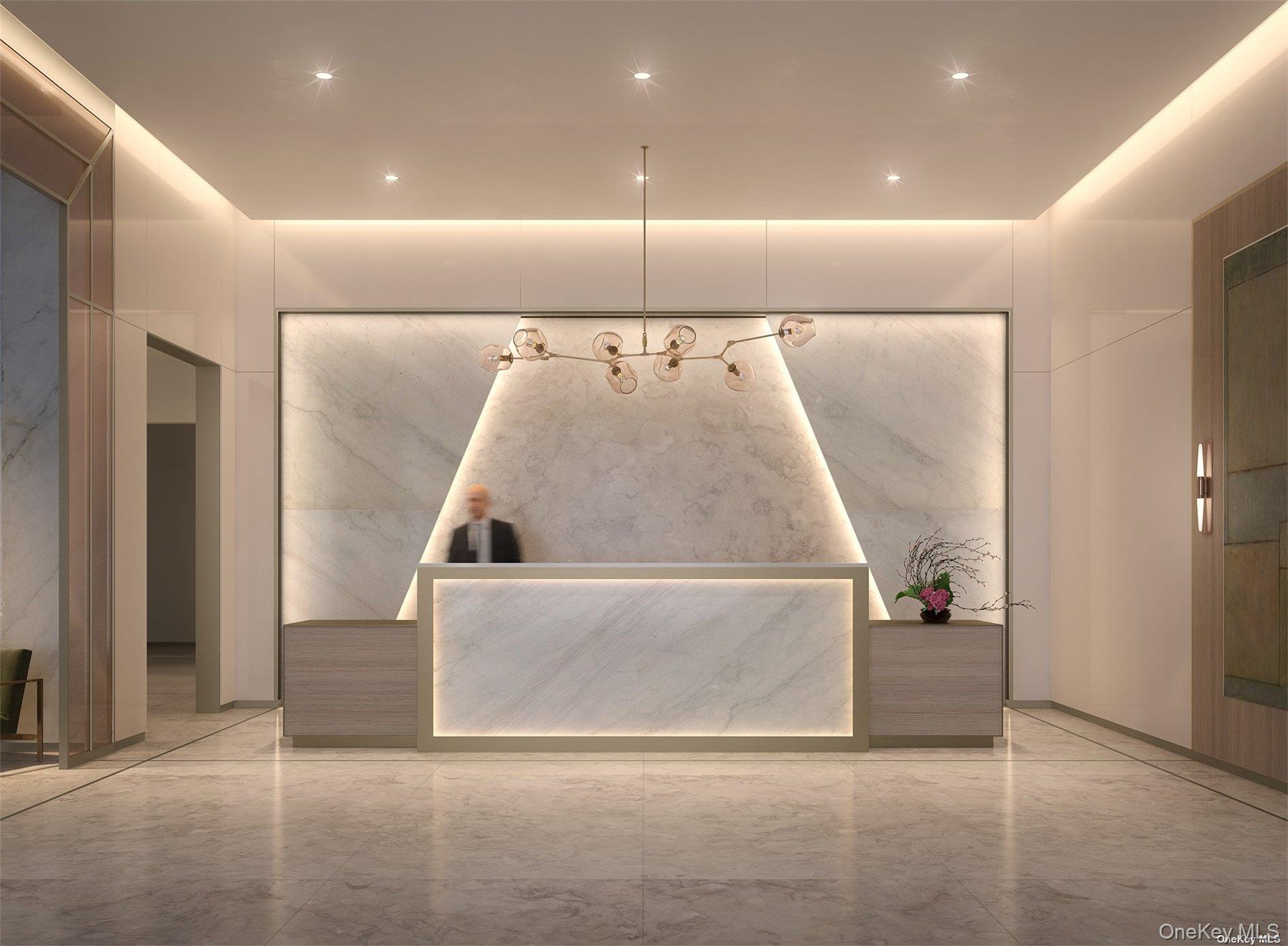 3 Court Square, Unit 704 Queens, NY 11101 - Photo 6 of 14 a view of kitchen with a sink and a refrigerator