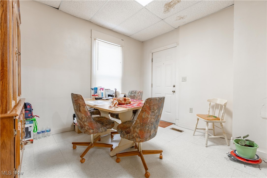 900 4th Street Southwest Canton, OH 44707 - Photo 14 of 31 Dining area with tile patterned floors and a paneled ceiling