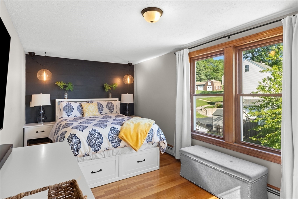 3 Scotland Heights Road Haverhill, MA 01832 - Photo 16 of 36 a bed sitting in a bedroom next to a window
