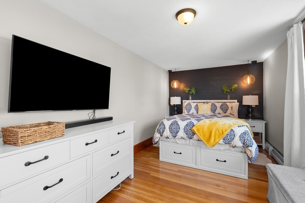 3 Scotland Heights Road Haverhill, MA 01832 - Photo 17 of 36 a living room with furniture and a flat screen tv