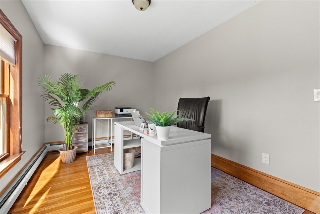 3 Scotland Heights Road Haverhill, MA 01832 - Photo 22 of 36 a living room with furniture and a potted plant