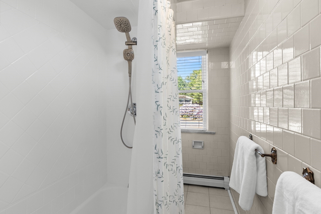 3 Scotland Heights Road Haverhill, MA 01832 - Photo 24 of 36 a bathroom with a glass shower door