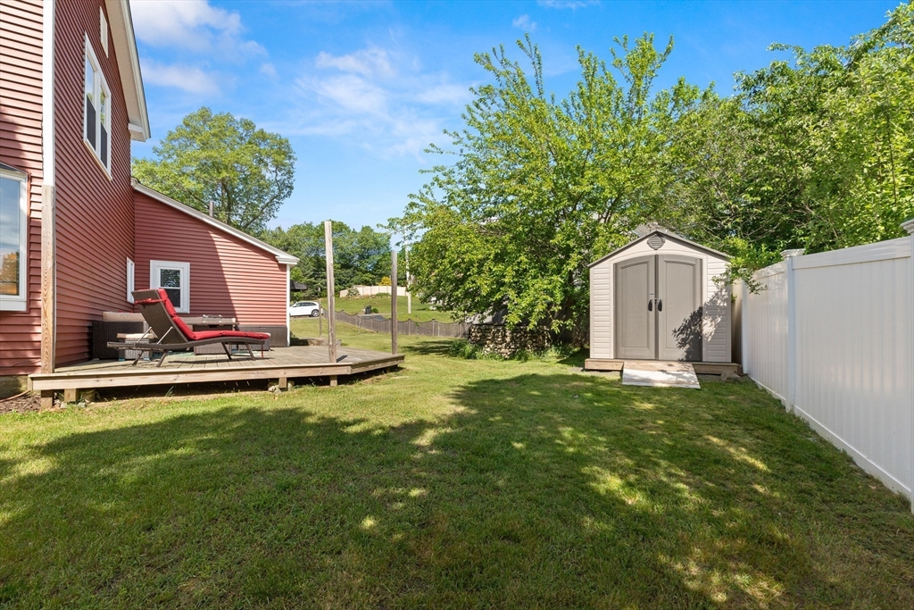 3 Scotland Heights Road Haverhill, MA 01832 - Photo 29 of 36 a backyard of a house with table and chairs a barbeque and a large window