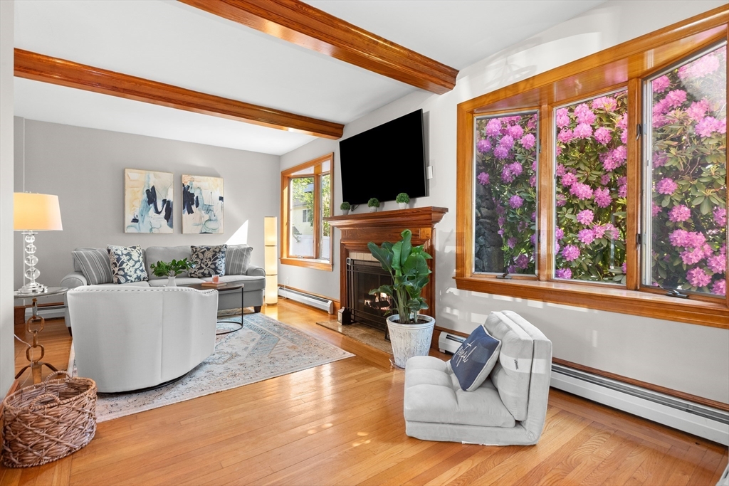 3 Scotland Heights Road Haverhill, MA 01832 - Photo 4 of 36 a living room with furniture a flat screen tv and a fireplace