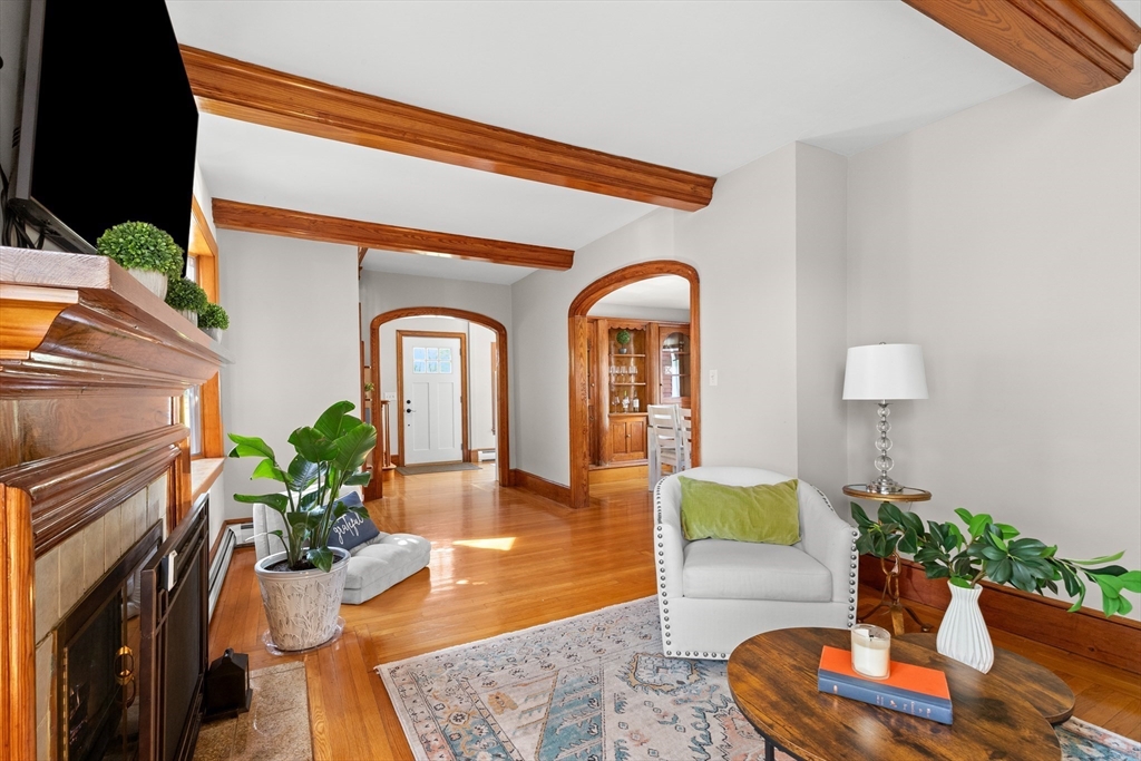 3 Scotland Heights Road Haverhill, MA 01832 - Photo 5 of 36 a living room with furniture potted plant and a fireplace