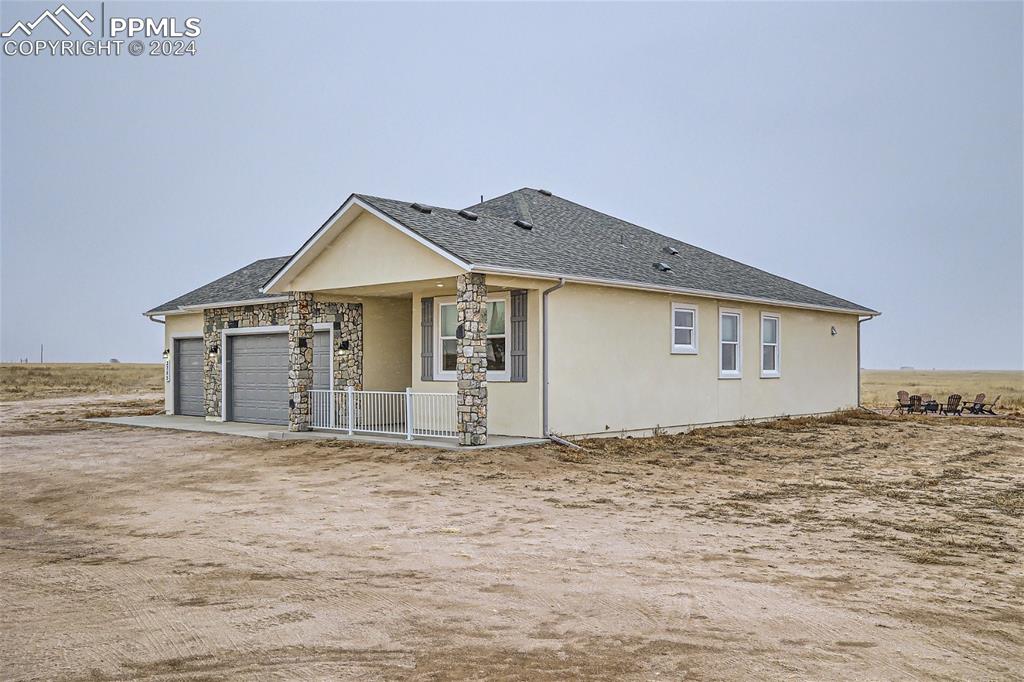 3755 North Rush Road Rush, CO 80833 - Photo 3 of 26 a view of a house with a yard