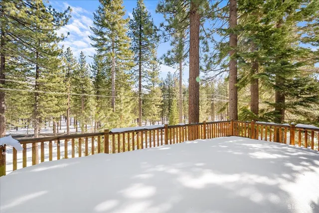 a bathroom with a granite countertop sink toilet and a mirror