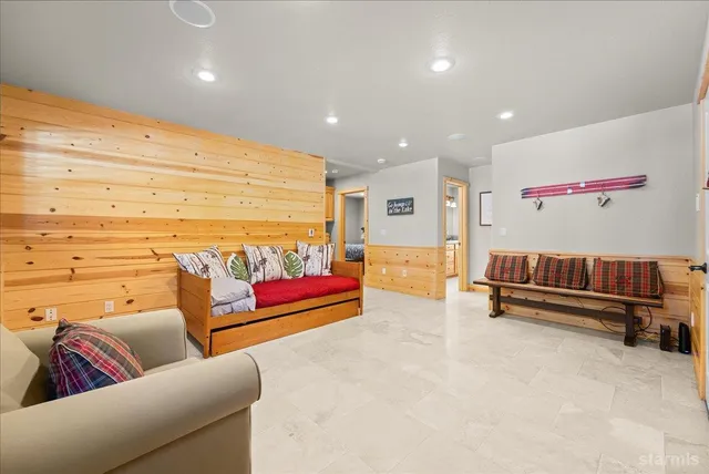 a living room with furniture and stairs