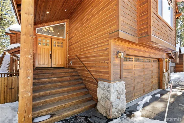 a view of a door of the house with a street