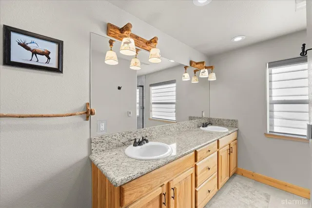 a bathroom with a glass shower door