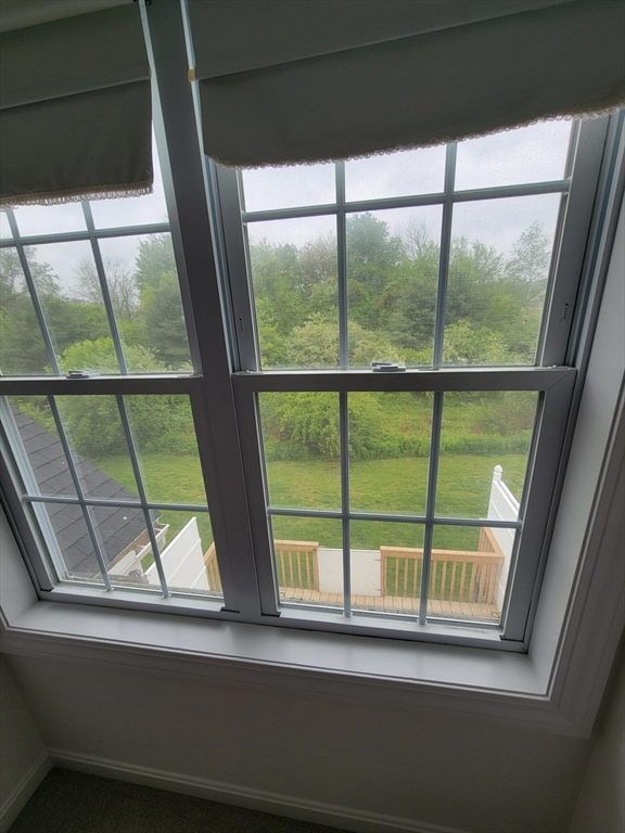 281 Rowley Bridge Road, Unit 7 Topsfield, MA 01983 - Photo 15 of 32 a view of a glass door with a from a window