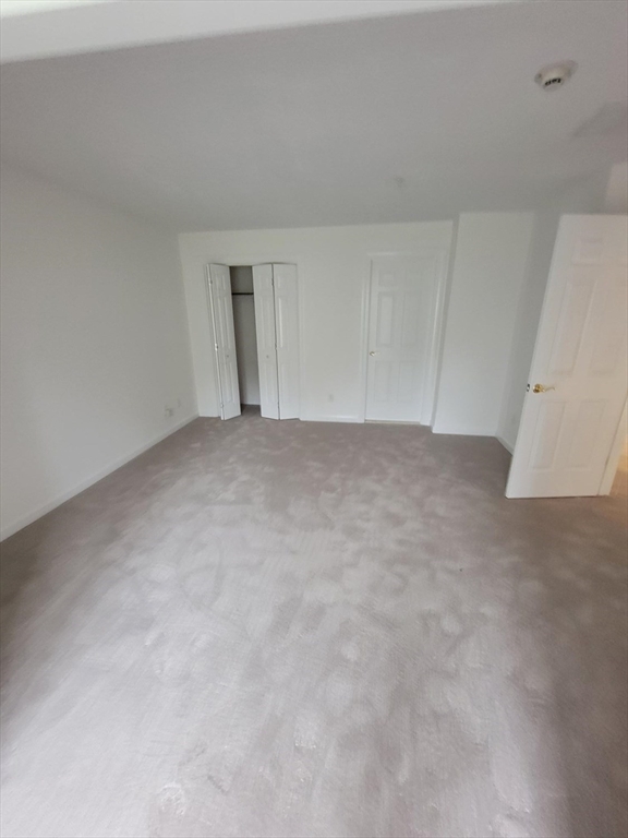 281 Rowley Bridge Road, Unit 7 Topsfield, MA 01983 - Photo 17 of 32 a view of an empty room and entryway