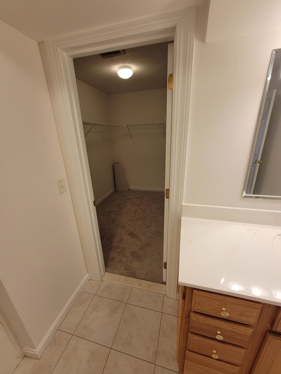 281 Rowley Bridge Road, Unit 7 Topsfield, MA 01983 - Photo 23 of 32 a bathroom with a vanity and a mirror