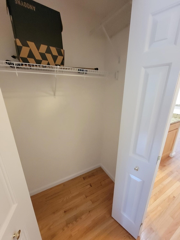 281 Rowley Bridge Road, Unit 7 Topsfield, MA 01983 - Photo 27 of 32 a view of a room with wooden floor