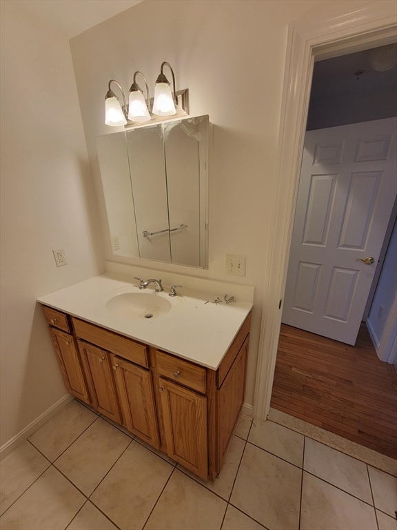 281 Rowley Bridge Road, Unit 7 Topsfield, MA 01983 - Photo 10 of 32 a bathroom with a sink and a mirror