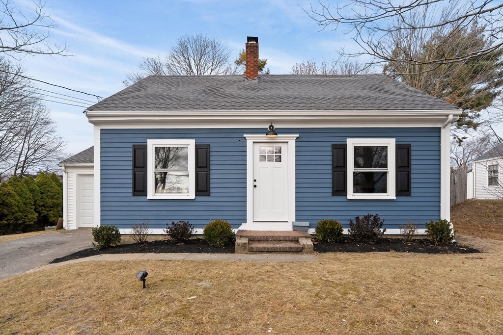 a front view of house with a yard