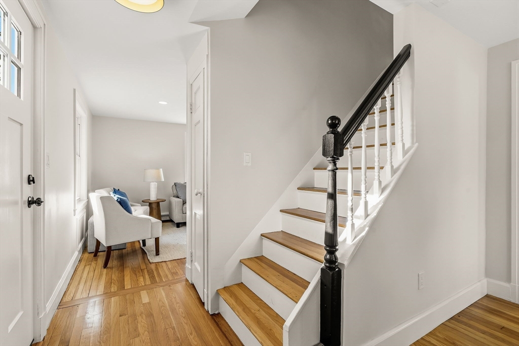 74 Magnolia Street Braintree, MA 02184 - Photo 19 of 35 a view of entryway with wooden floor and stairs