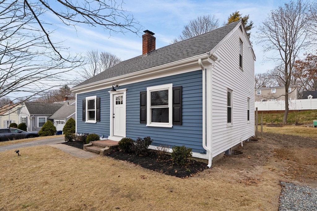 74 Magnolia Street Braintree, MA 02184 - Photo 2 of 35 a front view of a house with a yard