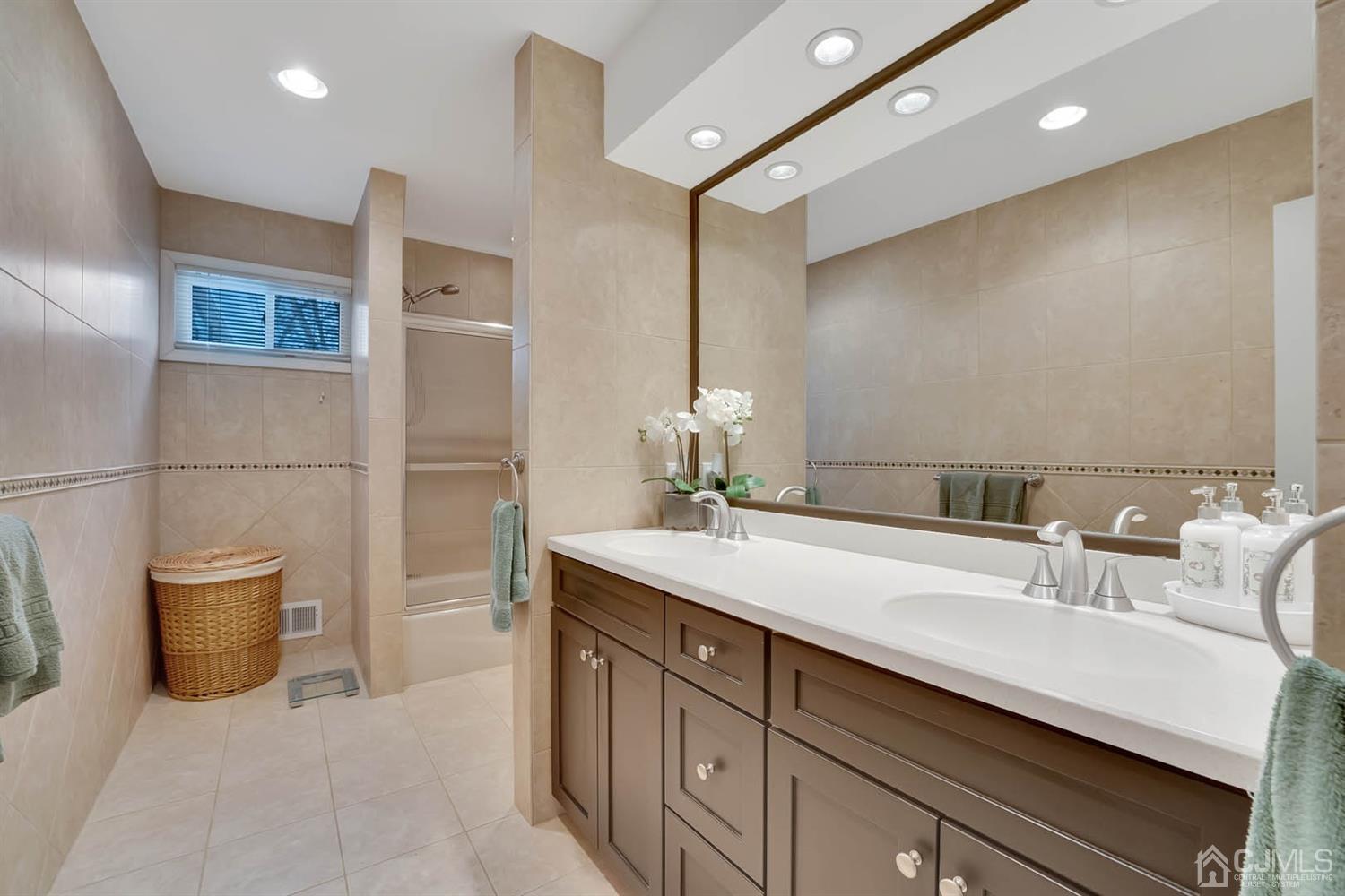 3032 Cheesequake Road Old Bridge, NJ 08859 - Photo 12 of 28 a bathroom with a sink double vanity and a mirror