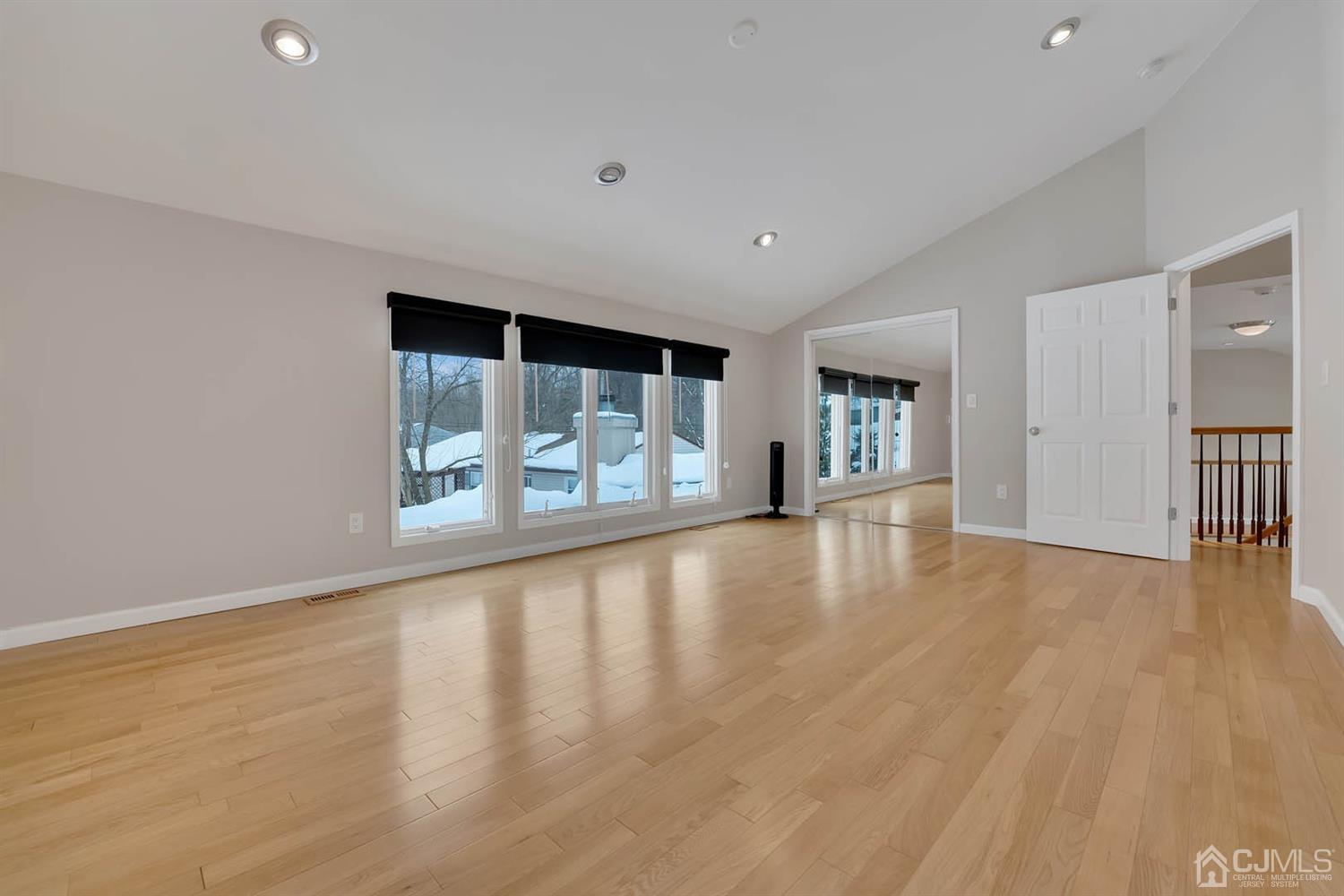3032 Cheesequake Road Old Bridge, NJ 08859 - Photo 19 of 28 a view of an empty room with a window and wooden floor