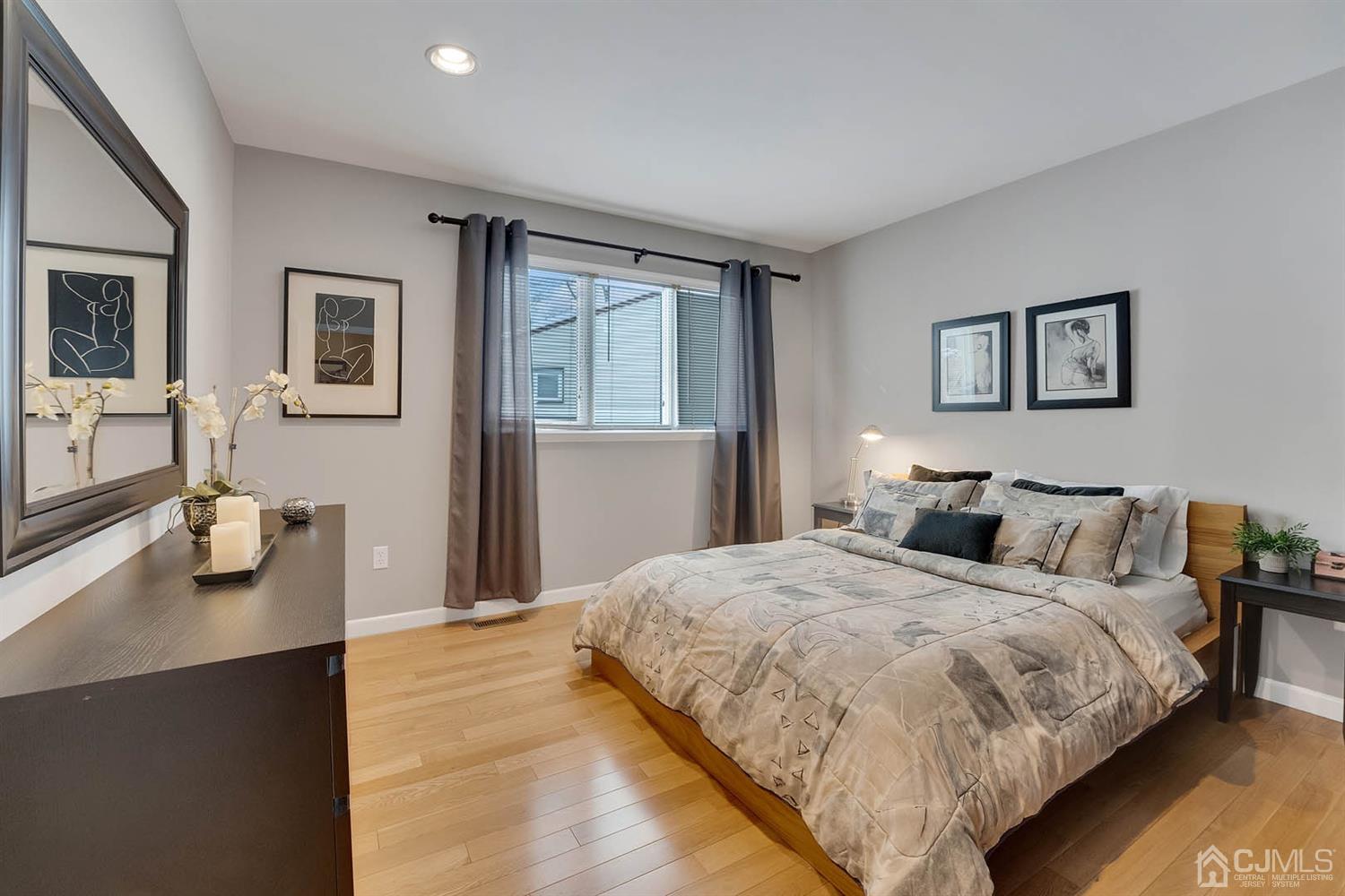 3032 Cheesequake Road Old Bridge, NJ 08859 - Photo 21 of 28 a bedroom with a bed and wooden floor