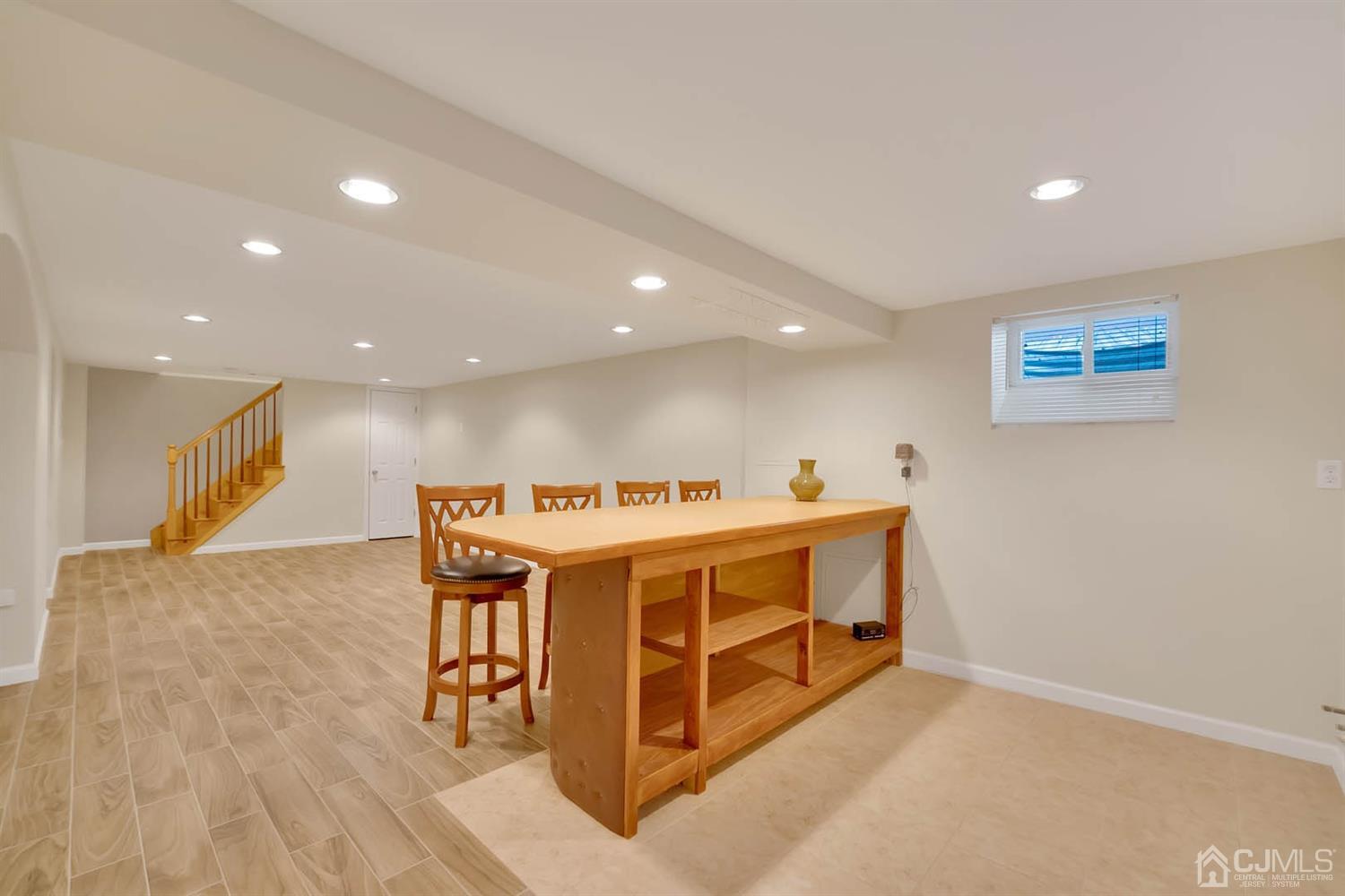 3032 Cheesequake Road Old Bridge, NJ 08859 - Photo 24 of 28 a view of a room with wooden floor and furniture