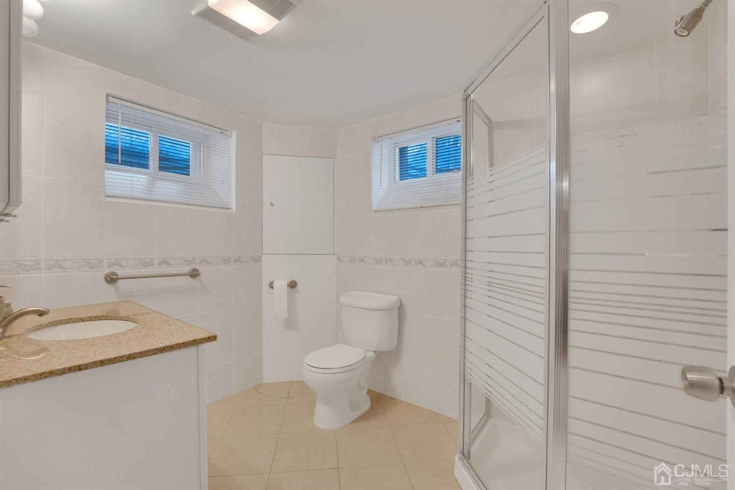 3032 Cheesequake Road Old Bridge, NJ 08859 - Photo 25 of 28 a bathroom with a granite countertop toilet and sink